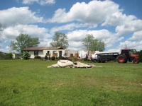 This home near Dog Town suffered extensive damage. Some of the exterior and interior walls have collapsed and the roof has been paritally removed. ~849 kb  